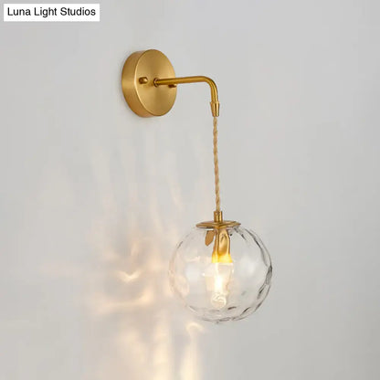 Modern brass wall sconce with a textured water glass shade and braided cord for bedroom e12 e14 lighting