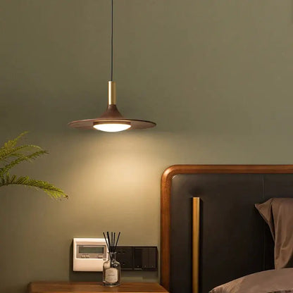 Modern bronze black walnut ufo pendant light with warm circular shade and brass accents for dining room decorbites black walnut