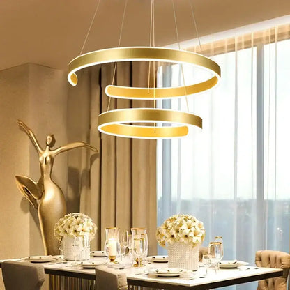 Modern bronze circle rings acrylic pendant light with gold-toned spiral rings and integrated led lighting for dining room decorbites circle rings