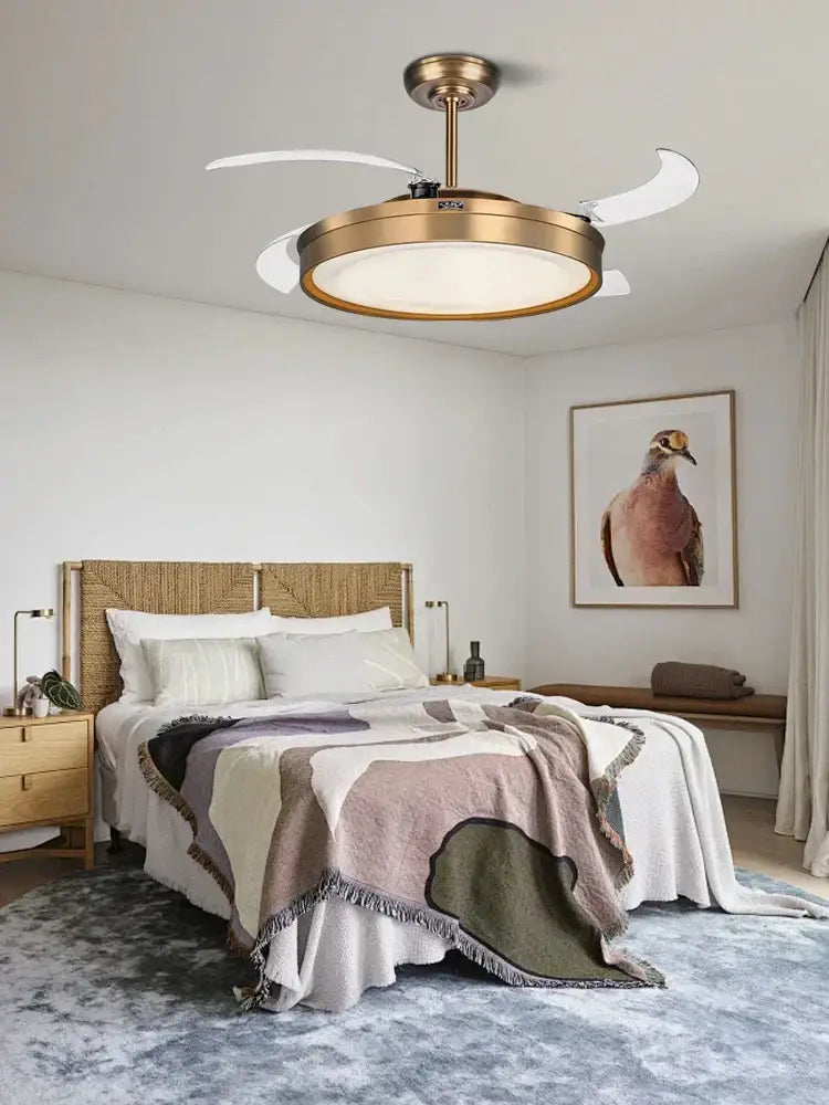 Brass-finished modern bronze ceiling fan light with three white curved reversible blades and circular fixture for living room
