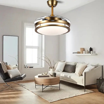 Brass-finished modern bronze circular ceiling fan with integrated ceiling fan light and reversible blades for living room use