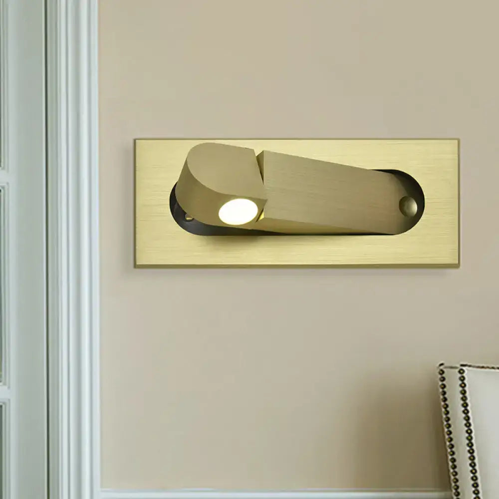 Modern bronze and coffee wall lamp with gold finish, sleek rectangular base, adjustable head, ideal for natural warm bedroom lighting