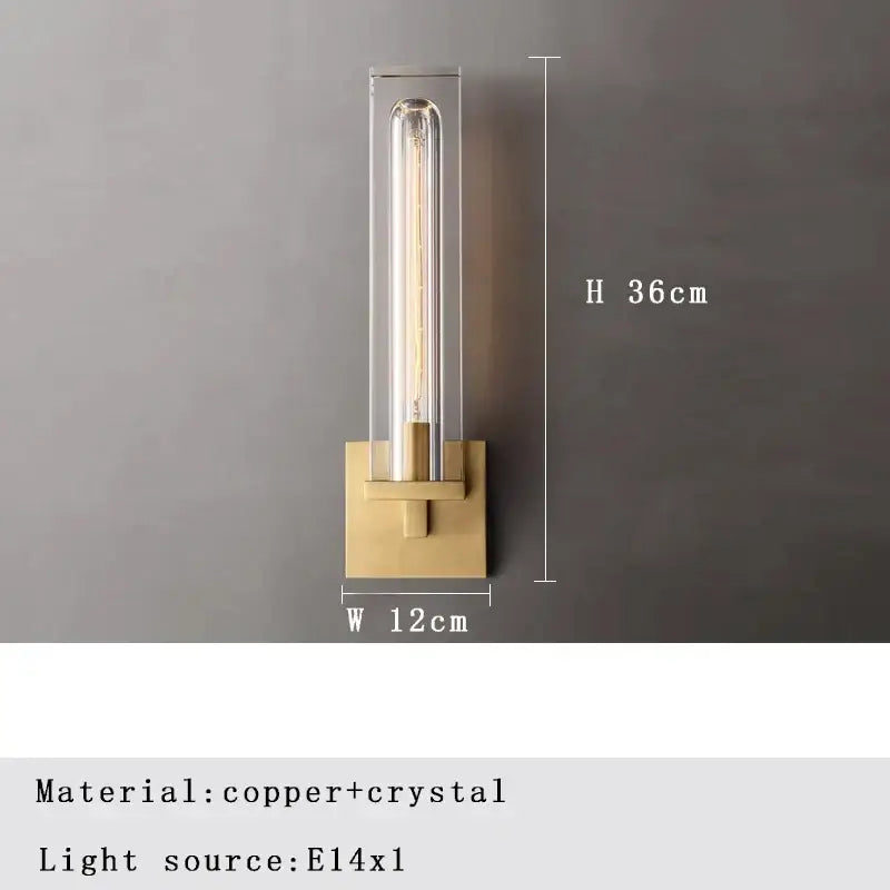 A sleek modern wall lamp with brass base and clear bronze copper crystal housing for bedroom lighting by decorbites