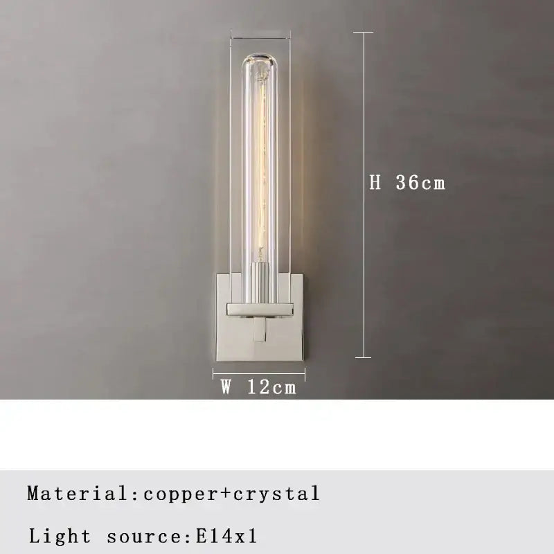 A sleek modern wall lamp with clear crystal tube and e14 bulb on a polished bronze copper base for bedroom decorbites bronze copper crystal