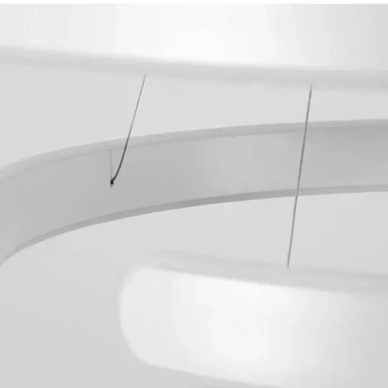 White curved toilet seat with black hinges shown alongside modern bronze geometric pendant light fixture for dining room