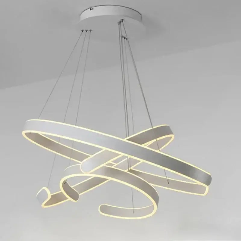 Modern white led pendant light fixture with interlocking circular rings and minimalist design for dining room