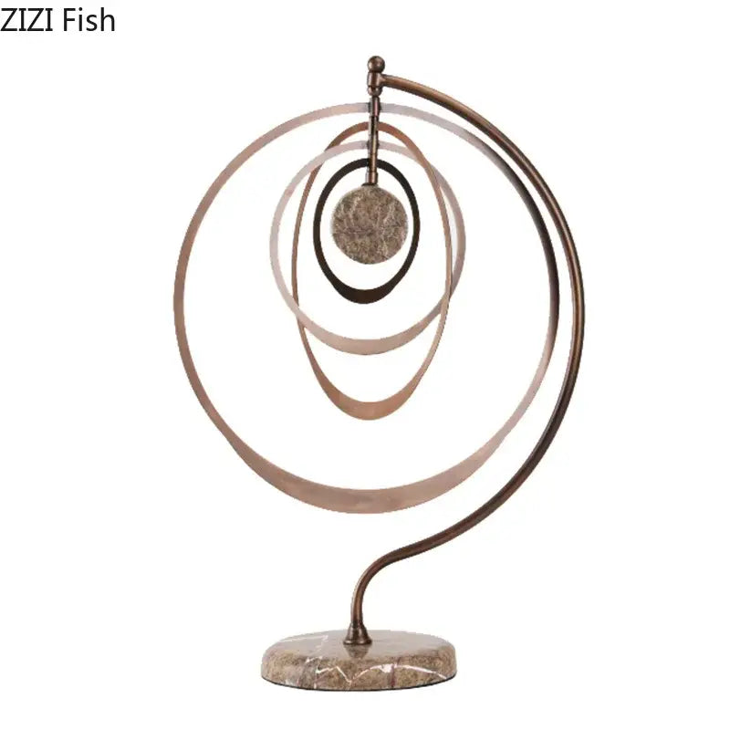 Modern bronze intertwined geometry sculpture with concentric rings and textured disc on marble base desk decoration decorbites geometry sculpture