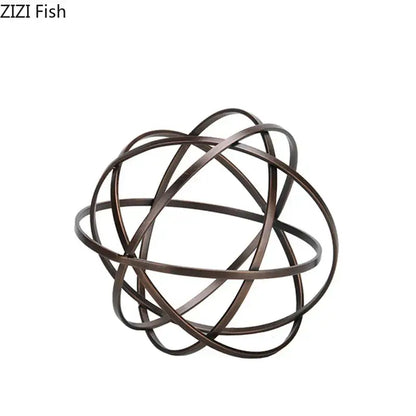 Modern bronze intertwined geometry sculpture with bronze finish metal sphere on marble base desk decoration by decorbites