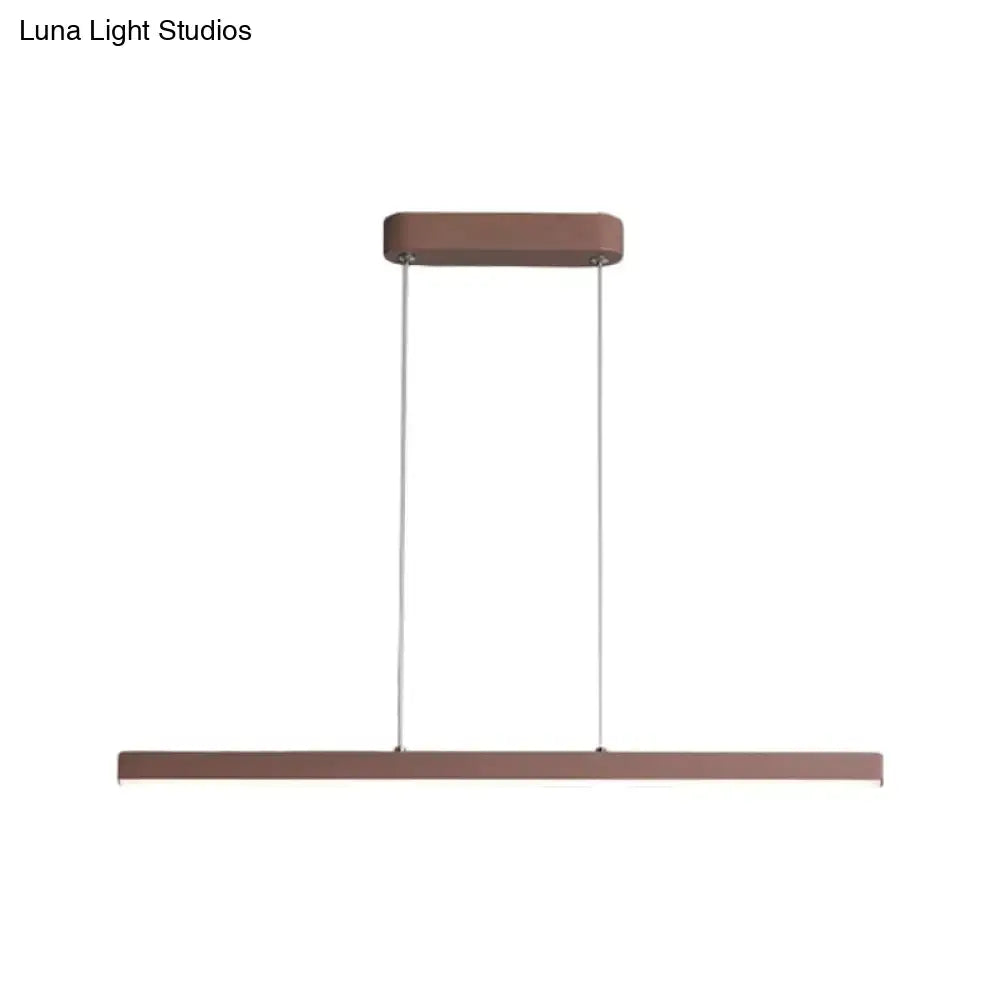 Modern rectangular metal pendant lamp in matte copper finish by DecorBites with warm white light and minimalist design