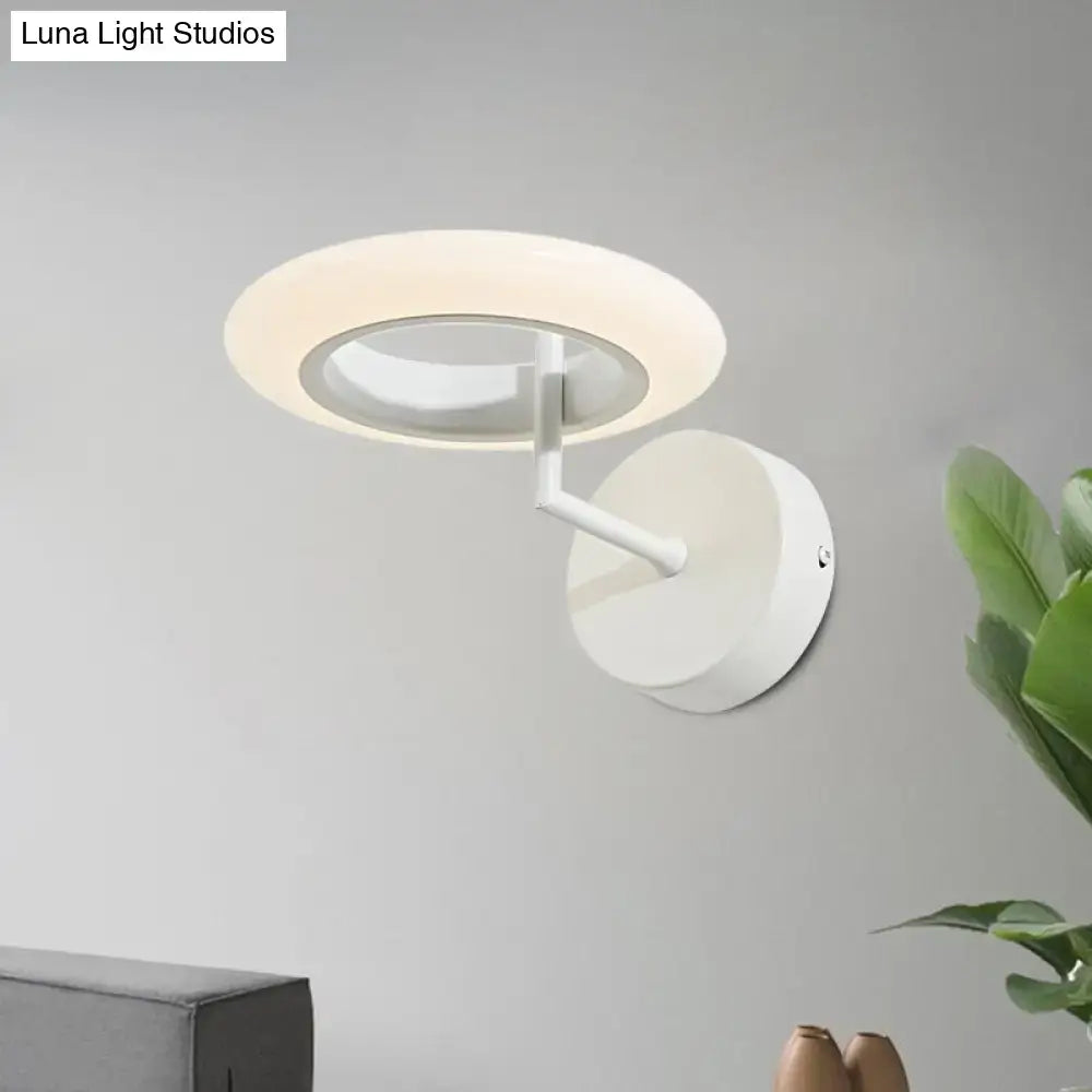 Modern white wall-mounted ring light with a sleek minimalist design is a 110v-120v wall light for bedroom use