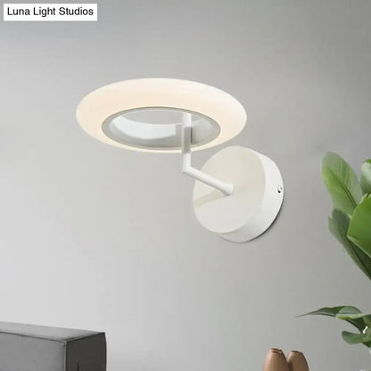 Modern white wall-mounted ring light with a sleek minimalist design is a 110v-120v wall light for bedroom use