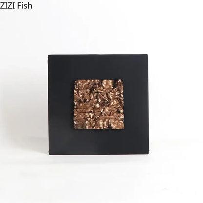 Black square wall art with textured metallic copper center featuring decorbites gilded fabric wall decor for living room