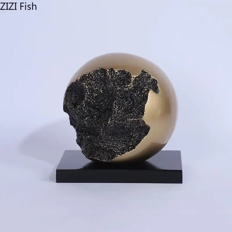 Modern bronze sphere sculpture desk ornament with cracked black textured surface on sleek black base for living room decorbites bronze sphere decor