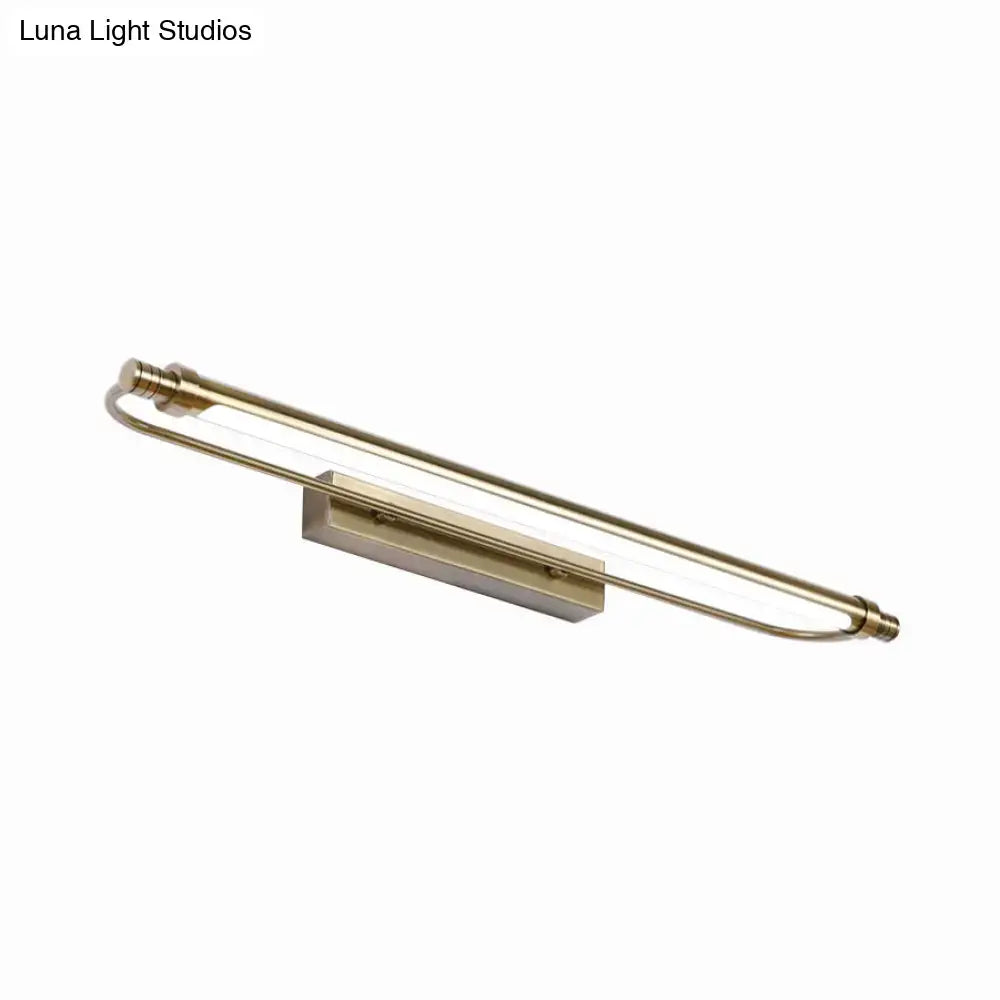 A sleek modern tubed vanity light fixture with brushed bronze finish providing warm white lighting for bathrooms