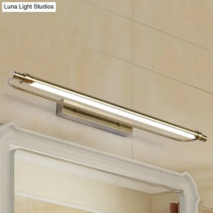 Modern bronze tubed vanity light fixture with brass finish and frosted glass diffuser providing warm white lighting