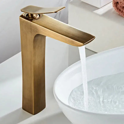 Modern bronze waterfall basin faucet with brass finish sleek minimalist design and integrated handle for bathroom use