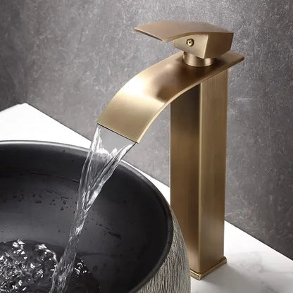 Modern bronze waterfall basin faucet with sleek rectangular spout flowing water into dark basin decorbites bronze basin faucet