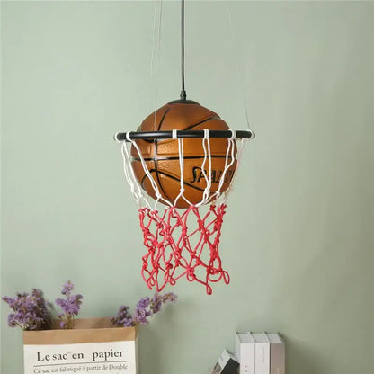 Modern brown basketball pendant lights feature a brown Spalding ball suspended in a white and red net for kids room decor