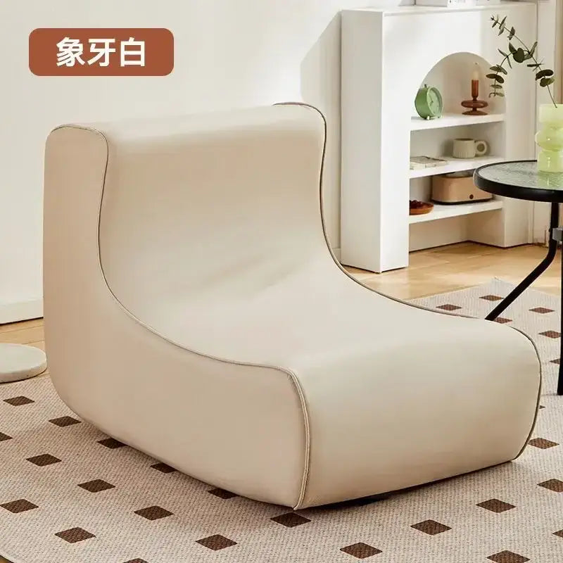 Modern cozy sofa chair in cream color with sleek leather upholstery and subtle stitching for living room comfort