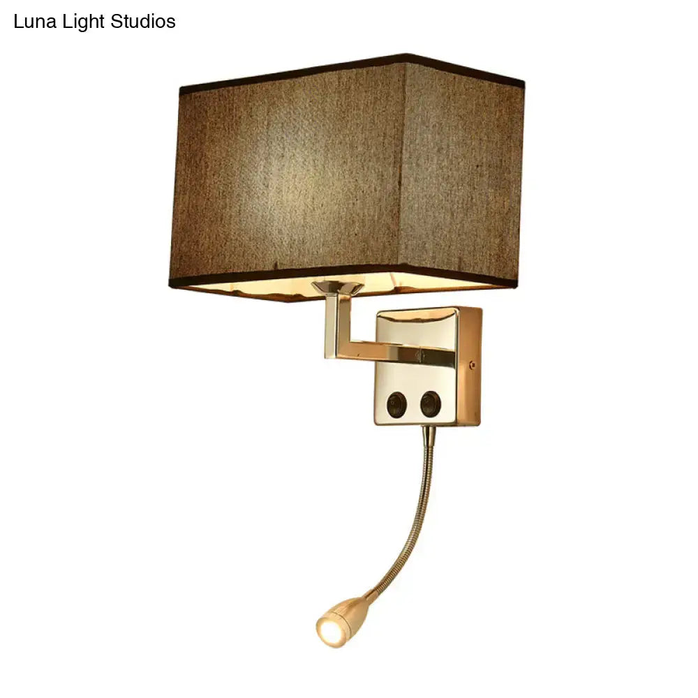 Brass-finished wall lamp with a rectangular brown fabric shade and adjustable gooseneck bedroom spotlight wall light