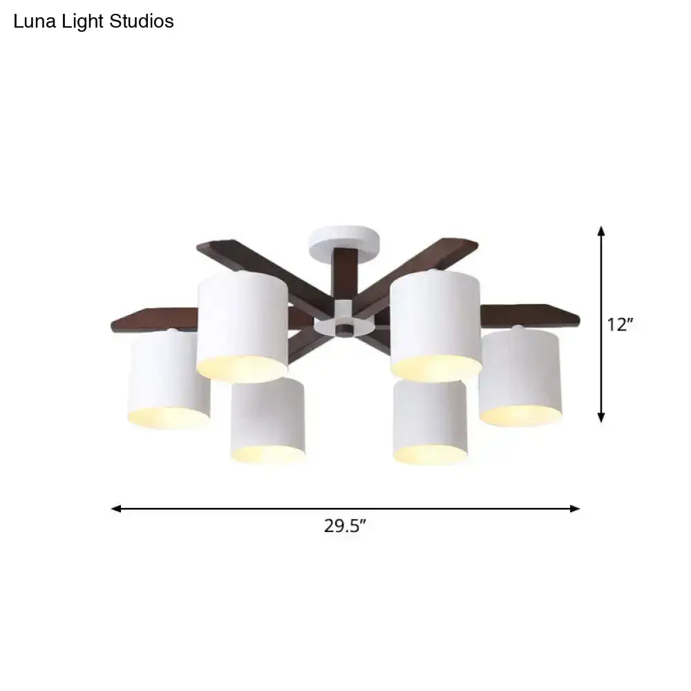 Modern brown and white ceiling mount chandelier with six cylindrical shades and dark wood arms for living room lighting by Luna Light Studios