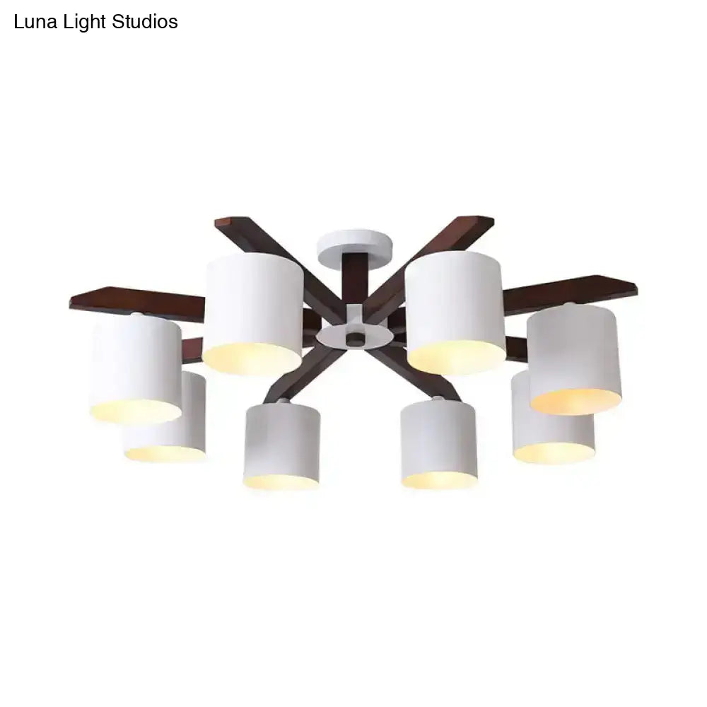 Modern brown and white ceiling mount chandelier with six cylindrical shades and dark wood arms for living room lighting