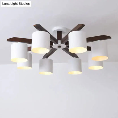 Modern brown and white ceiling mount chandelier with six cylindrical shades and dark wood arms for living room lighting