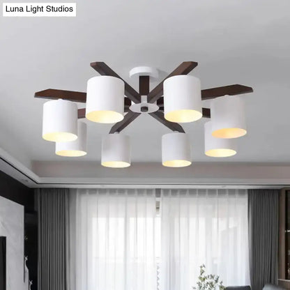 Modern brown and white ceiling mount chandelier with six cylindrical shades and dark wood arms for living room lighting