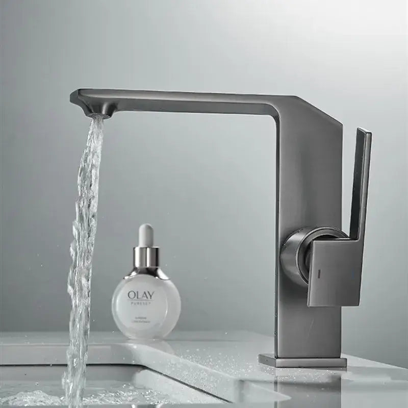 Modern matte gray basin faucet with sleek angular design and single lever handle complementing decorbites brush gold style