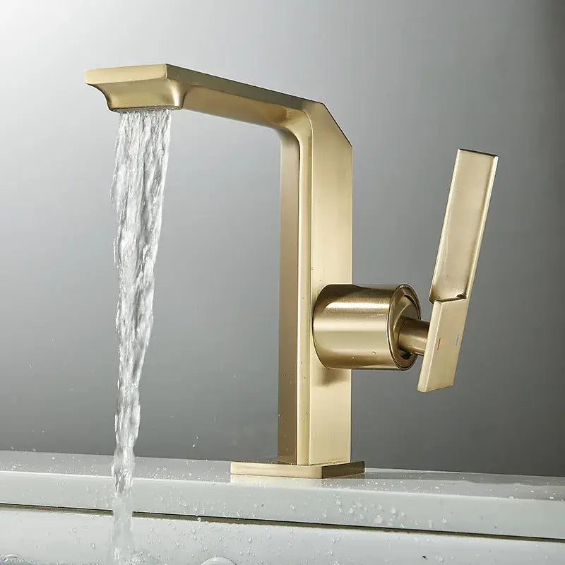 Modern brush gold basin faucet with sleek angular design and waterfall spout by decorbites for bathroom use