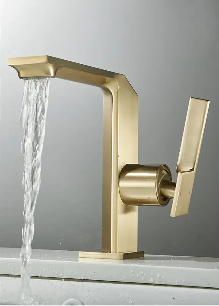 Modern brush gold basin faucet with sleek angular design and waterfall spout for decorbites brush gold collection
