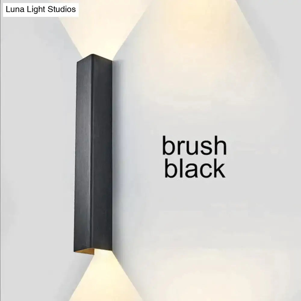 Modern brushed aluminum rectangular wall sconce in black with sleek design for bedroom ambient lighting