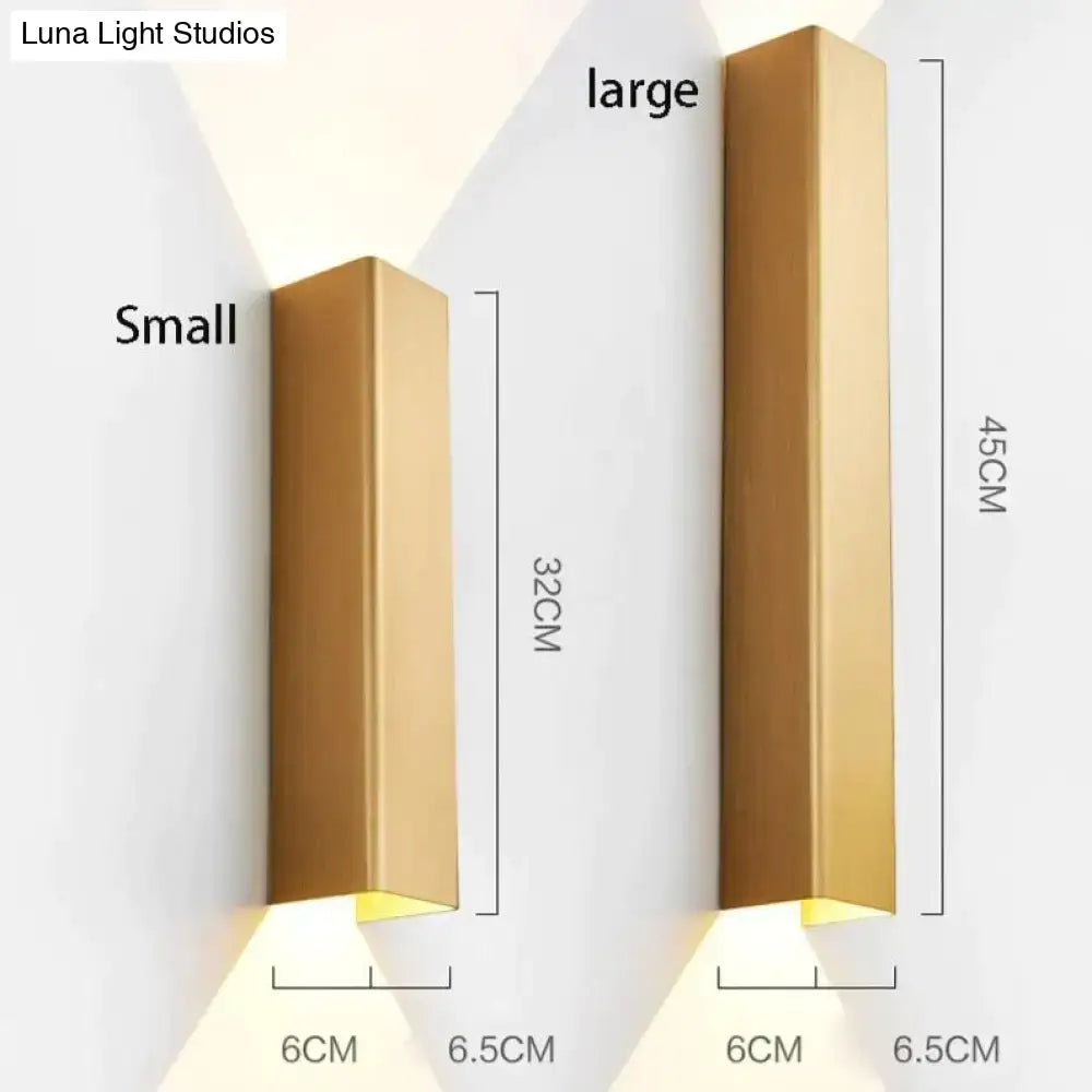 Modern brushed aluminum rectangular wall sconces in gold finish available in small and large sizes for ambient bedroom light