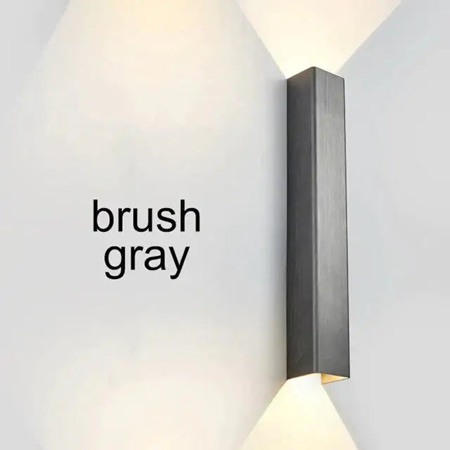 Modern brushed aluminum rectangular wall sconce in gray with sleek design for ambient bedroom lighting