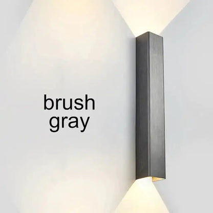 Modern brushed aluminum rectangular wall sconce in gray with sleek design for ambient bedroom lighting
