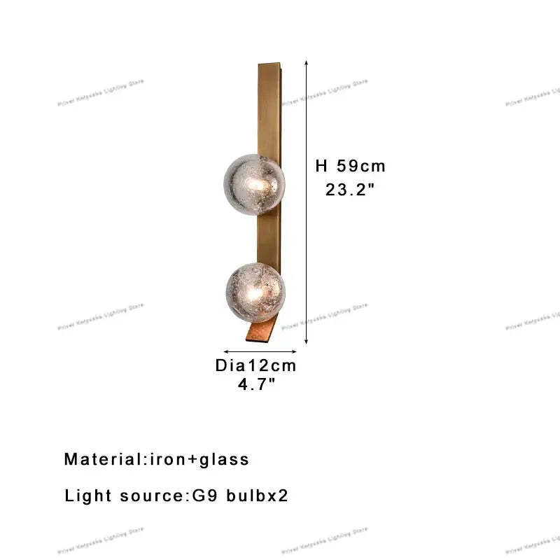 Modern brushed brass wall sconce lamps with two frosted glass globe shades for bedroom lighting