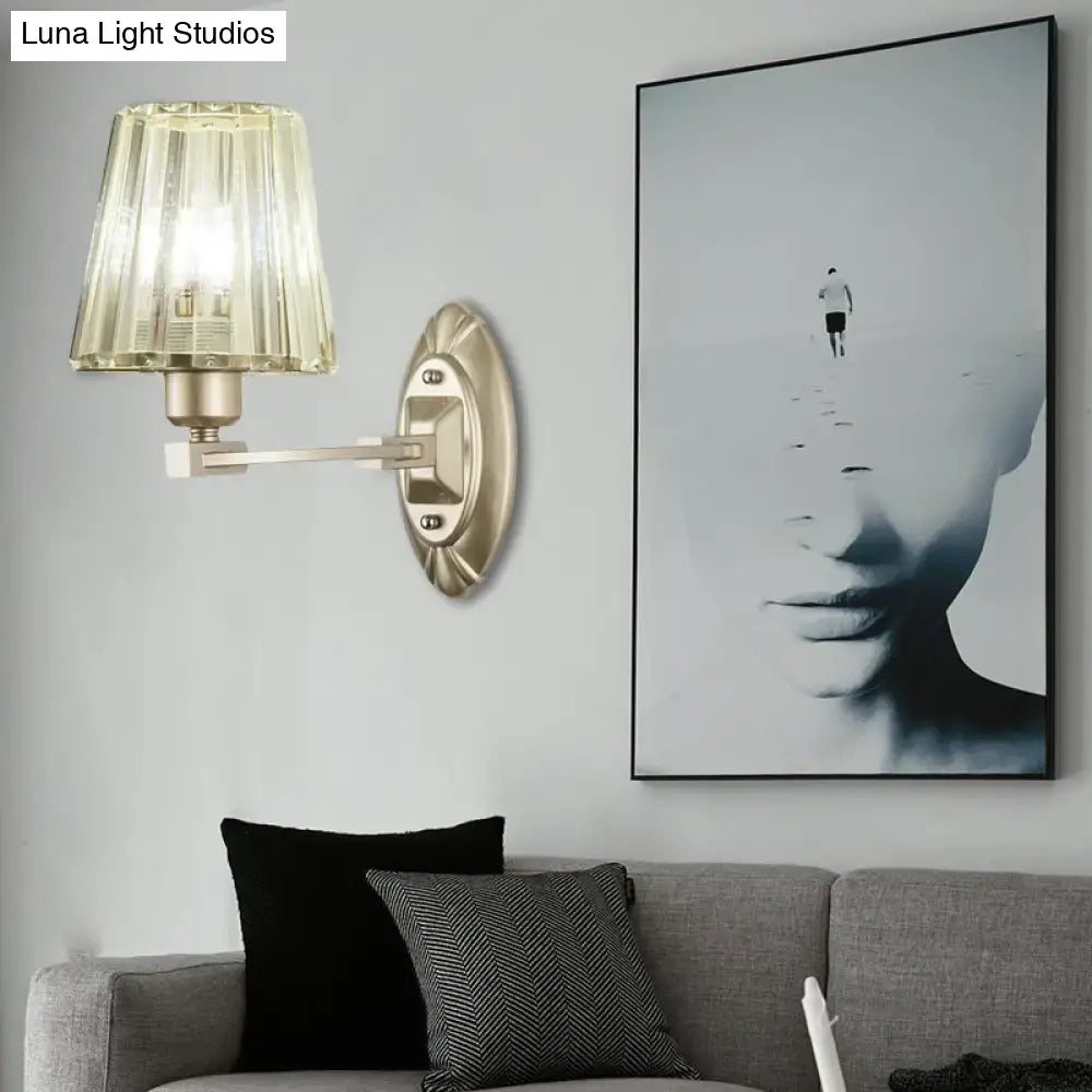 Modern brushed brass wall sconce with faceted translucent amber glass shade wall light fixture for bedroom use