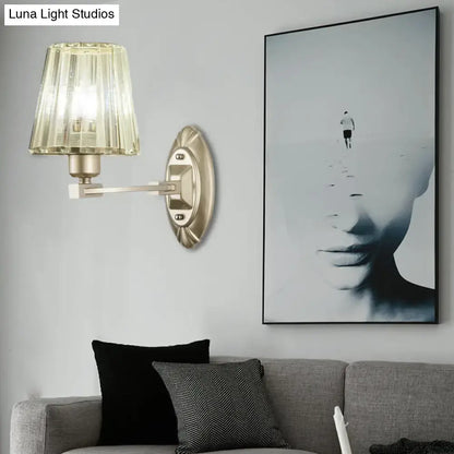 Modern brushed brass wall sconce with faceted translucent amber glass shade wall light fixture for bedroom use