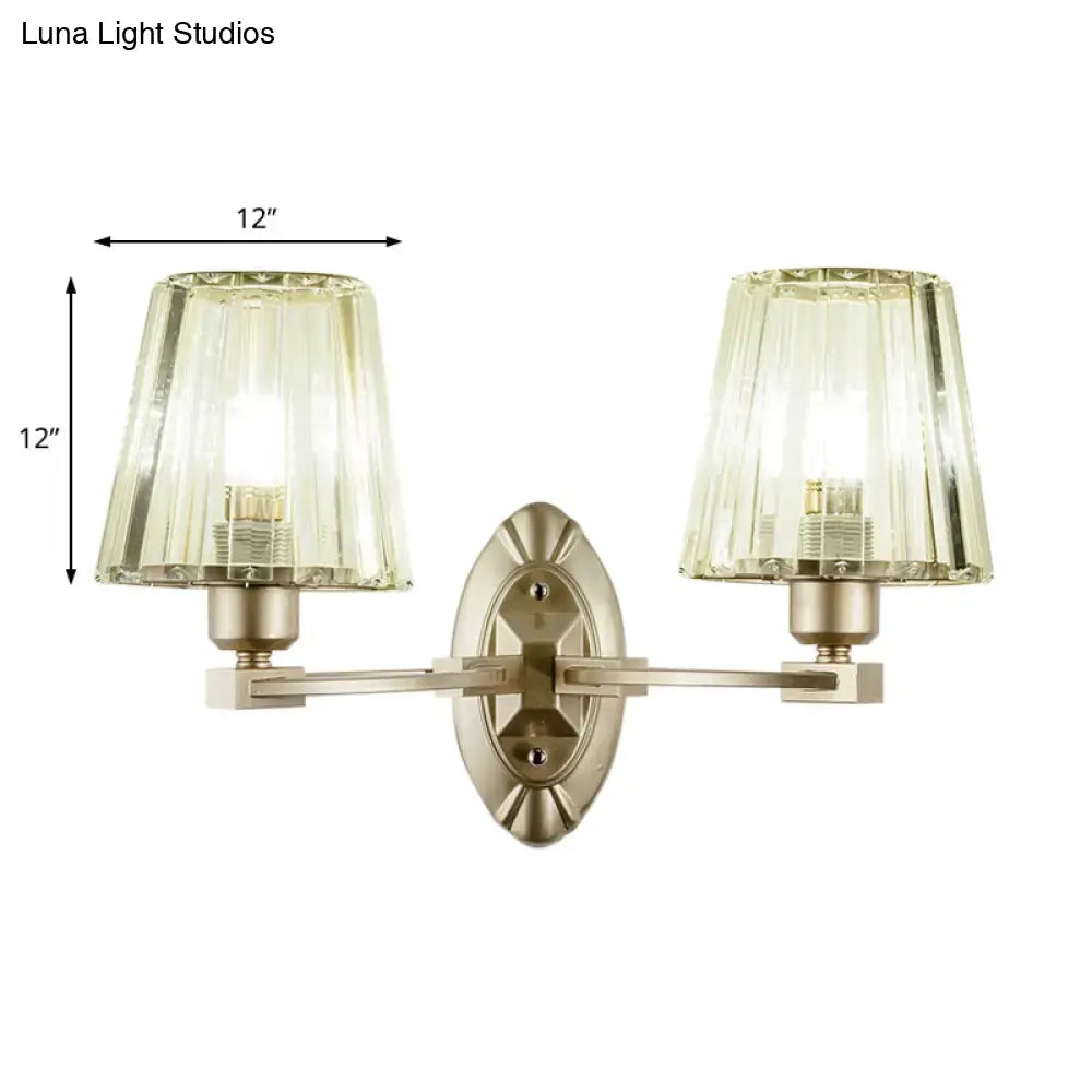 Vintage-style wall sconce with two amber glass shades and brushed nickel frame modern wall light fixture