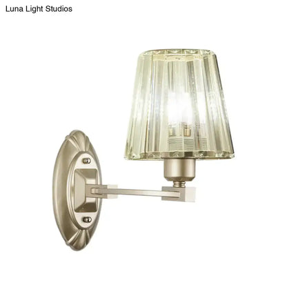 Modern brushed nickel wall sconce with a faceted amber glass shade wall light fixture for bedroom use