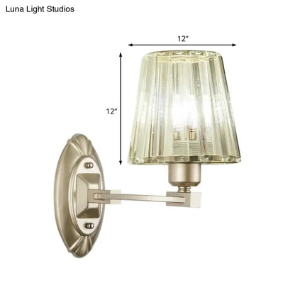 Modern brushed brass wall sconce with a fluted crystal glass shade wall light fixture for bedroom lighting