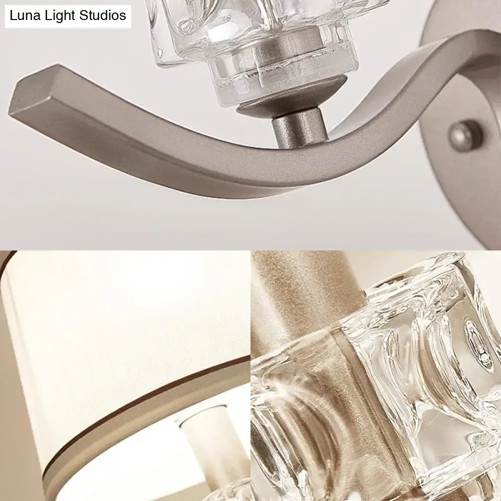 Modern sconce light with brushed nickel finish and clear faceted glass shades for elegant wall light lighting
