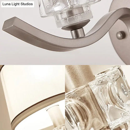Modern sconce light with brushed nickel finish and clear faceted glass shades for elegant wall light lighting