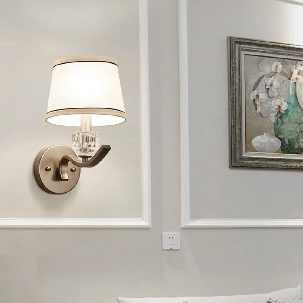 Modern brushed brass sconce light with clear crystal accent and white fabric shade for hallway wall light use