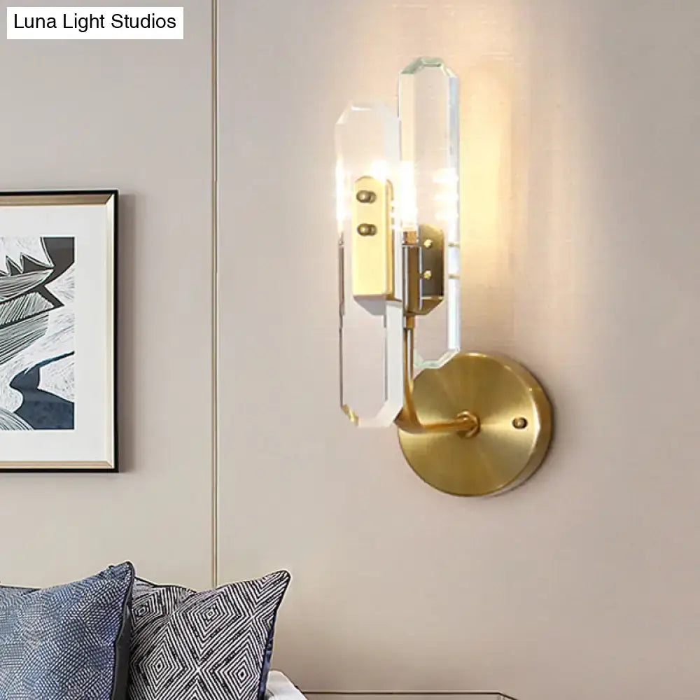 Modern brushed brass wall mounted sconce with clear crystal shade glass panels for living room lighting