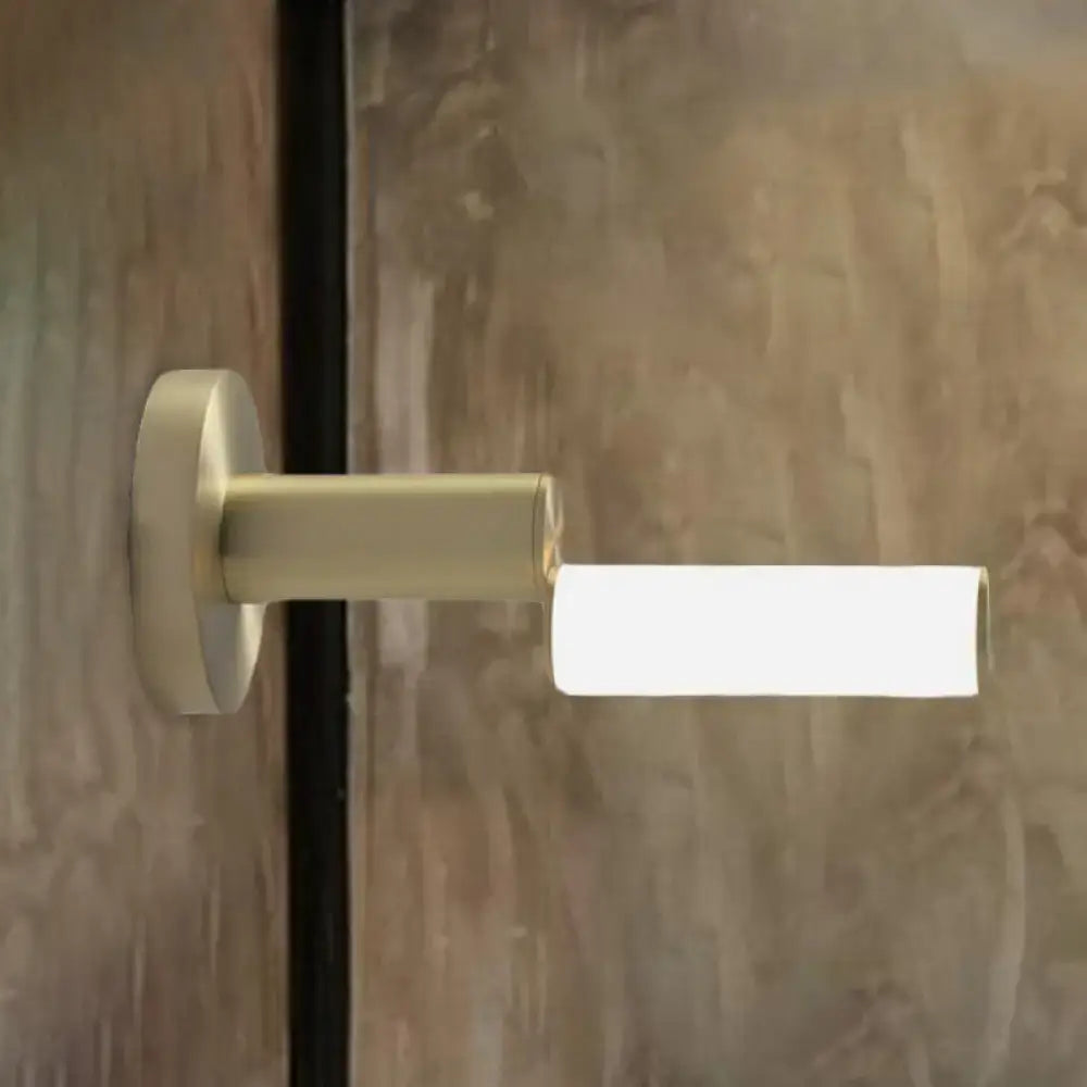 Modern brushed brass led door handle with gold metal finish and acrylic shade for bedroom featuring minimalist design