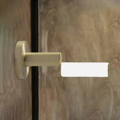 Modern brushed brass led door handle with gold metal finish and acrylic shade for bedroom featuring minimalist design