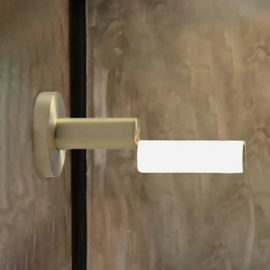 Modern brushed brass led door handle with gold metal finish and acrylic shade for bedroom featuring minimalist design