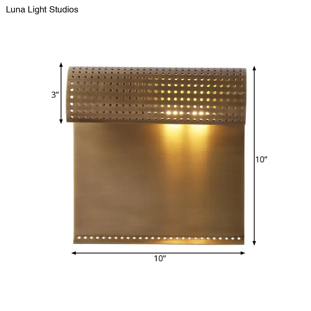 Modern brushed brass scrolled wall sconce with perforated trim for wall mounted bedroom lighting
