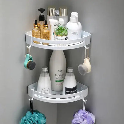White two-tiered corner shelf caddy with hooks for bath accessories in decorbites brushed gold aluminum finish